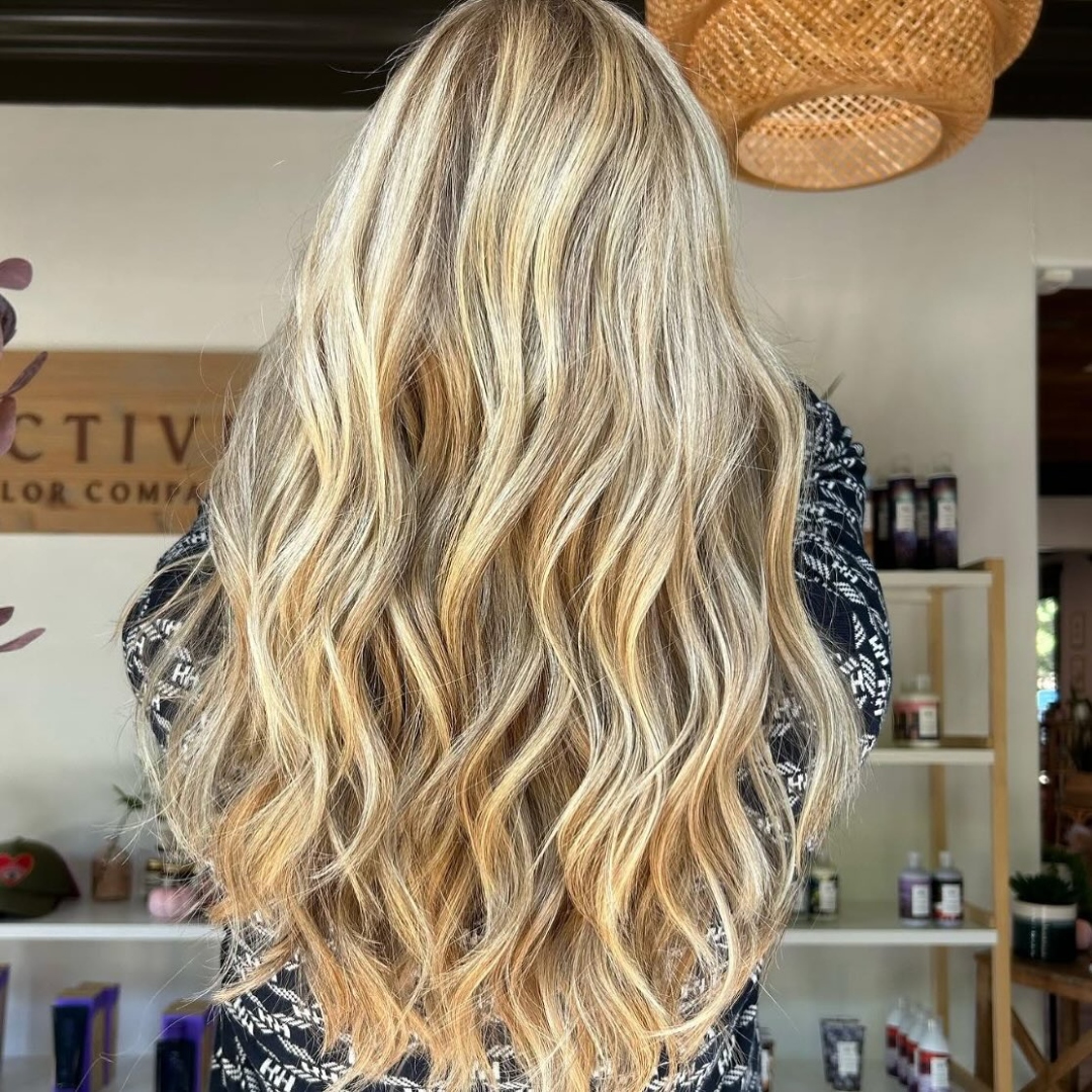 Bright dimensional blonde balayage with beachy waves