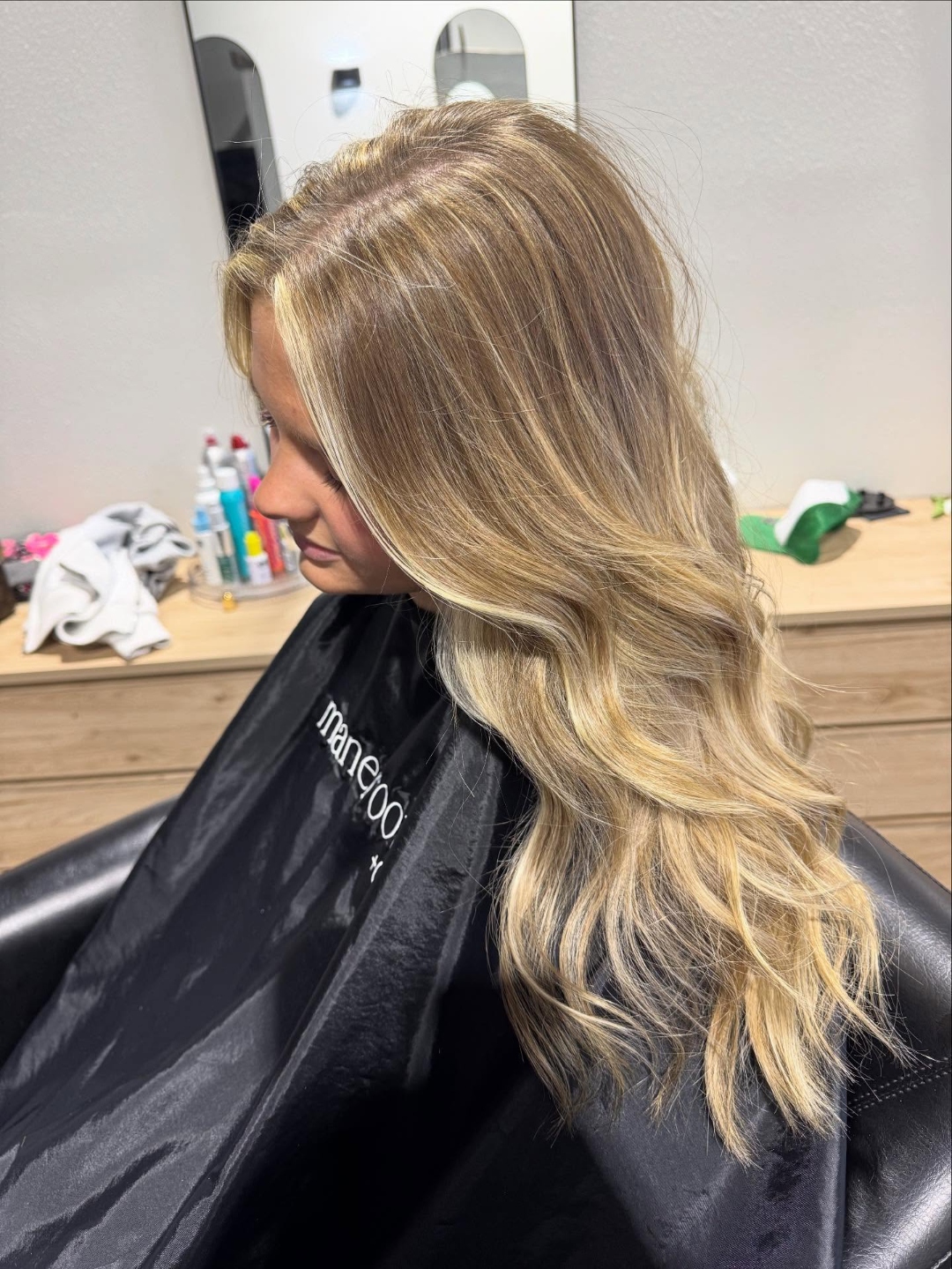 Soft natural blonde with a lived-in melt and waves